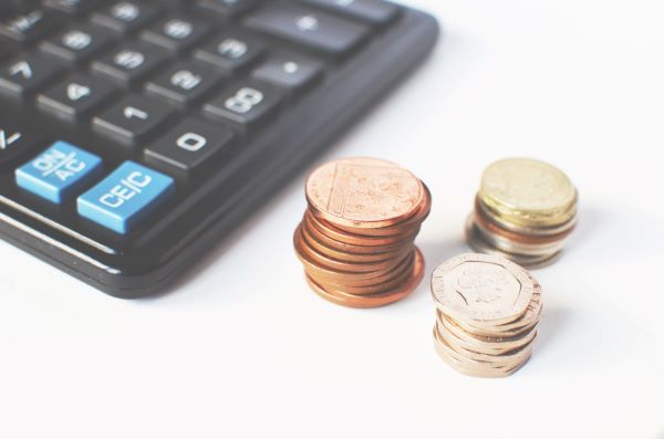Coins near a calculator