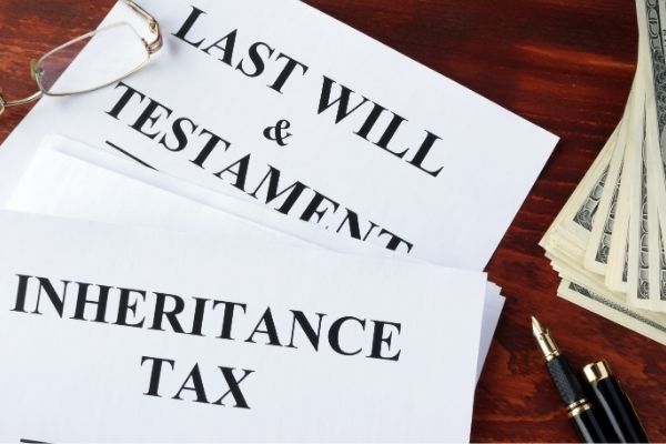 Inheritance tax form on a table and cash