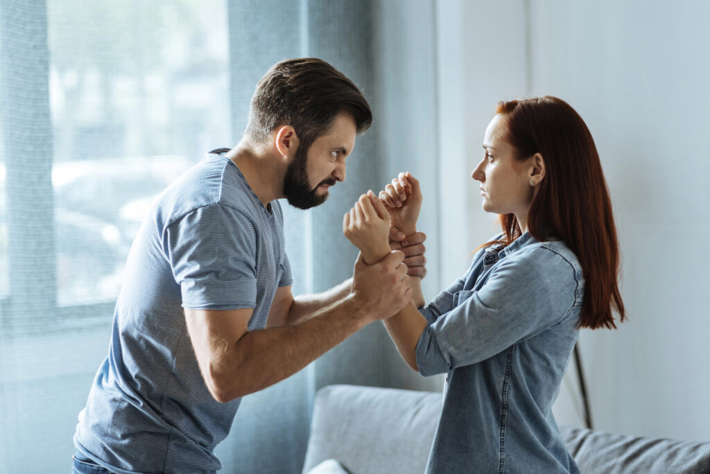 A husband gripping his wife’s wrists during an argument during divorce discussions; seeking protection orders.