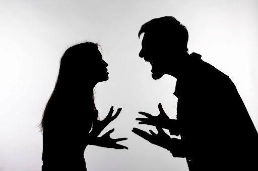 Silhouettes of a man and woman shouting at each other. Understanding domestic violence laws can help determine an effective way to present domestic violence cases in court.
