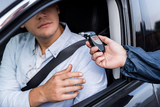 Man considers consequences of refusing breathalyzer during traffic stop.