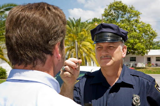 A police officer administering field sobriety tests.