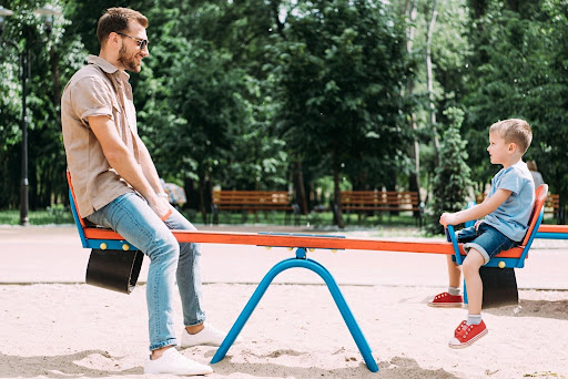A father spending time with his son, illustrating one of the positive effects of divorce on children.