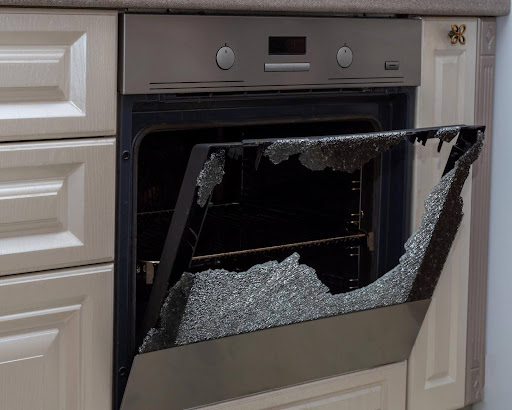 A defective home appliance with shattered glass; a product liability lawyer can help pursue compensation for injuries caused by defective products.